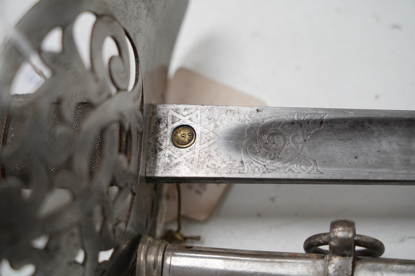 An 1895 pattern late Victorian infantry officer’s sword in its steel scabbard, made by E. Thurkle, 5 Denmark St. Soho, blade 83cm. Condition - good, however scabbard heavily cleaned